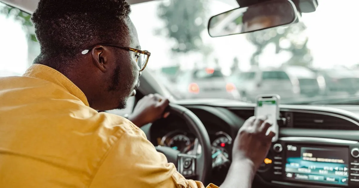 Driver Using Real-Time Parking App To Find Available Spaces Efficiently