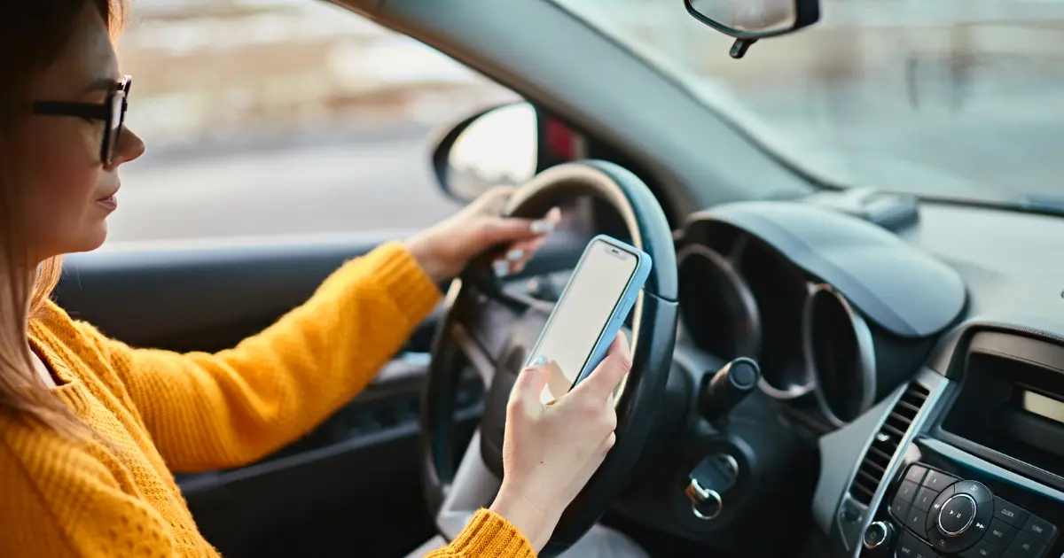 Female Driver Using Mobile To Find Parking Via An App Female Driver Using Mobile To Find Parking Via An App
