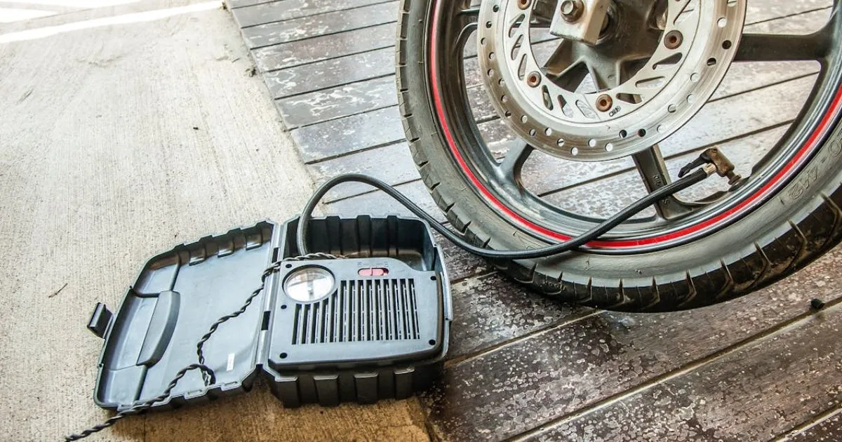 Filling Air In The Tyre By Using Portable Air Compressor