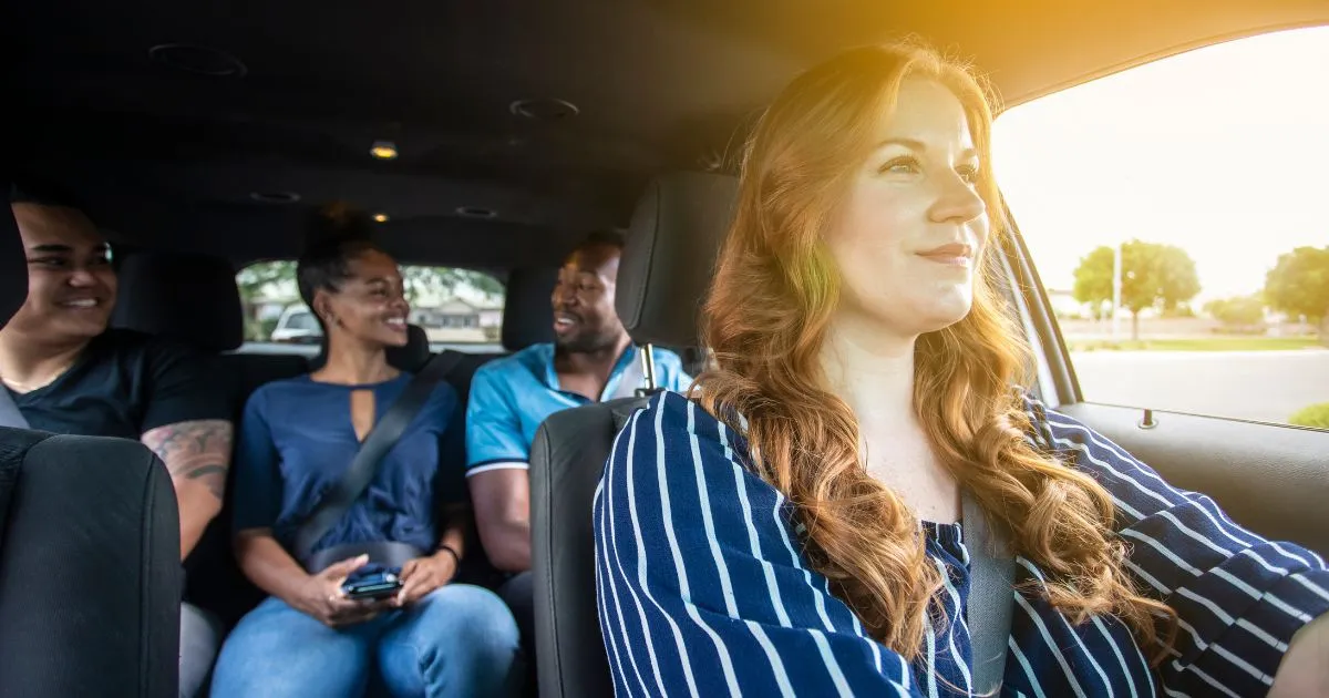 Four People Sharing The Same Car To Go To Work