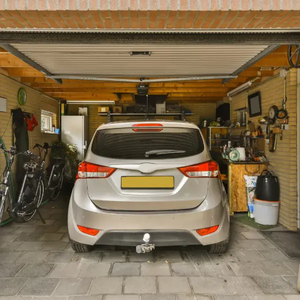 Car parked inside a safe spot showing local parking for rent that protects your vehicle from weather and theft risks.