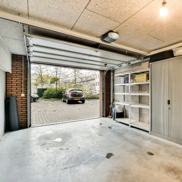 Empty private garage ready to rent parking space that is clean and offers secure parking for daily or long term storage.