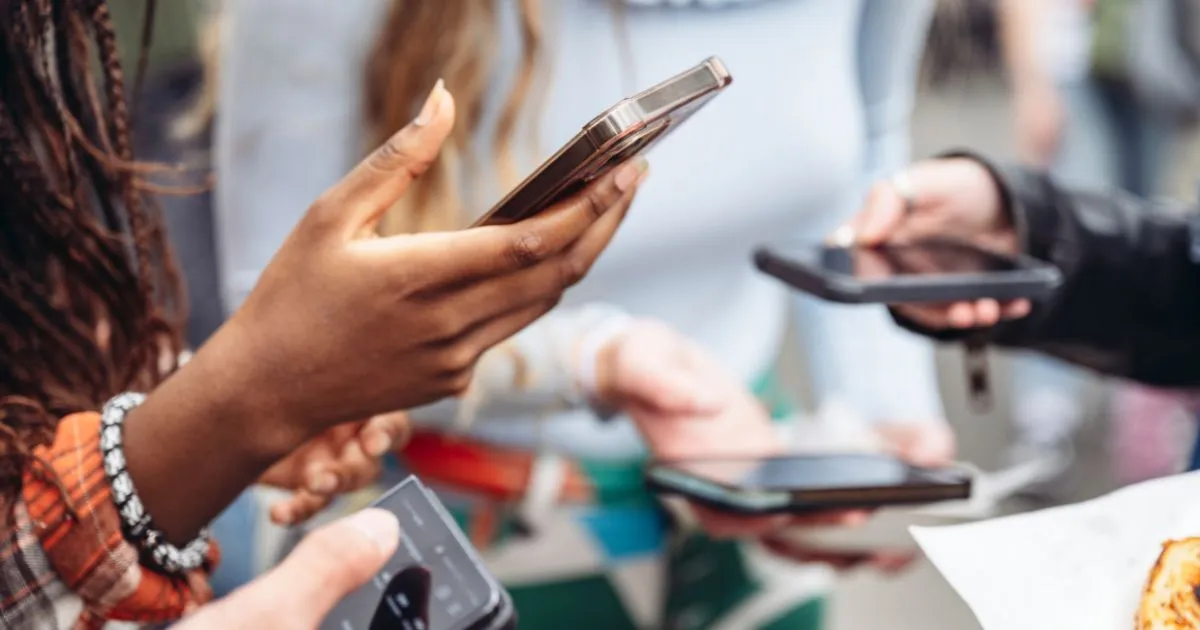 Ladies With Phones In Their Hands Using Social Media