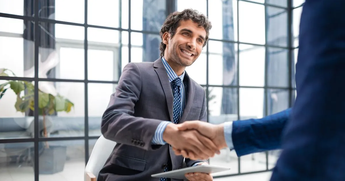 Manager Of A Parking Company Shakes Hand With The Successful Candidate For A Job Position Manager Of A Parking Company Shakes Hand With The Successful Candidate For A Job Position