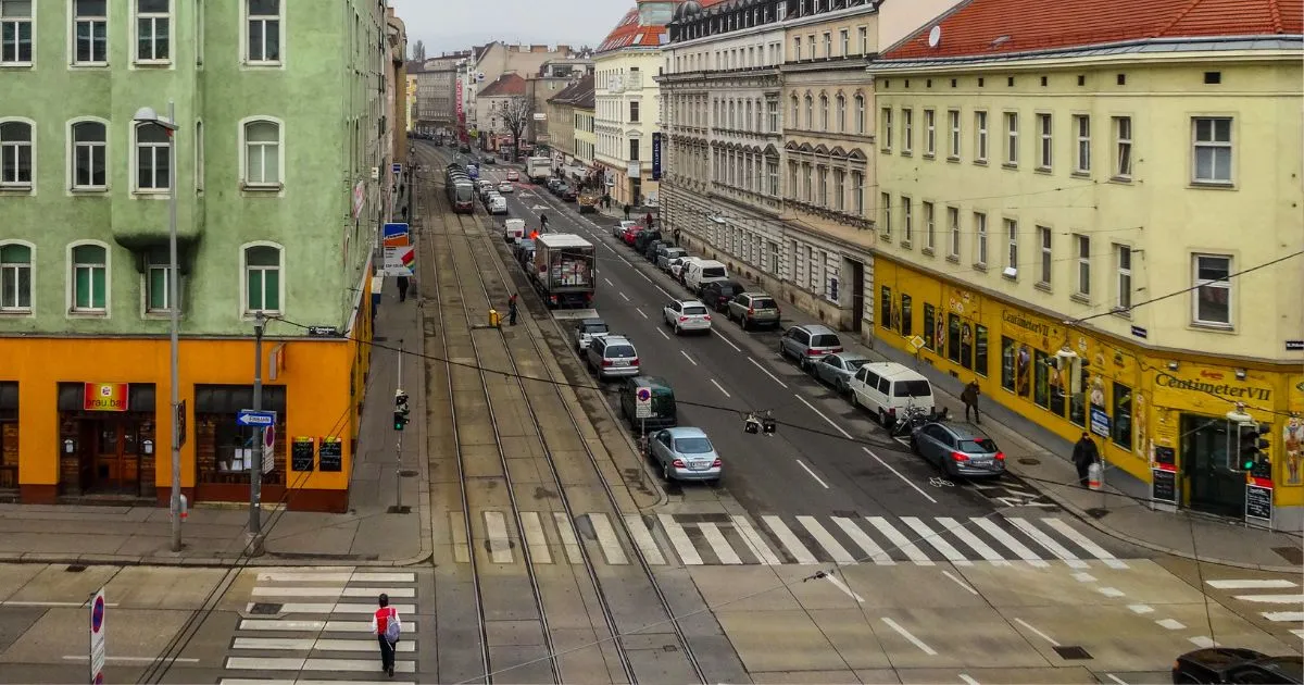Multiple Cars Parked Near An Intersection In A City