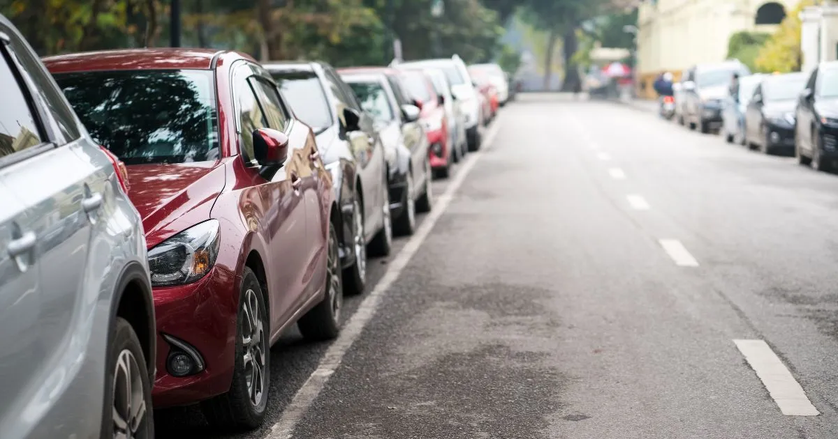 Multiple Cars Parked On Both Sides Of The Main Street Multiple Cars Parked On Both Sides Of The Main Street