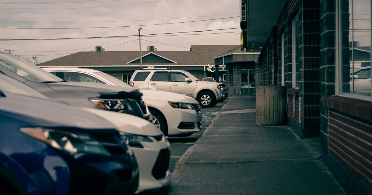 Multiple Cars Parked On The Street In The Evening