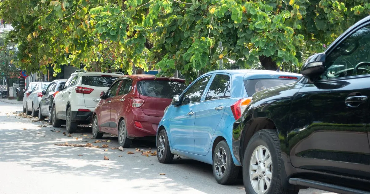 Multiple Parallel Parked Cars On A Street In The Autumn Season
