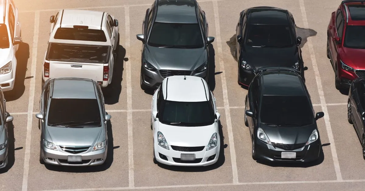 Multiple Vehicles Parked In An Outdoor Airport Car Park