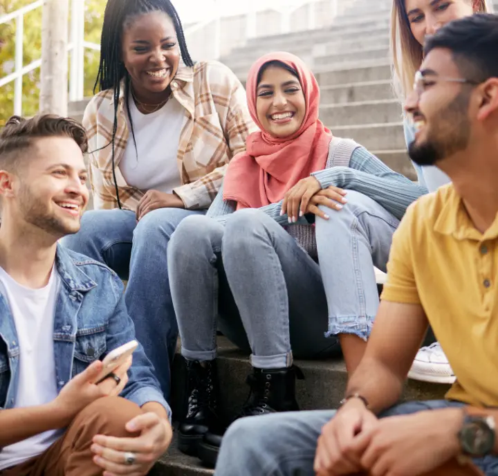 Friends Planning With Earn Free Parking Credits Now Friends sitting on steps planning a trip with earn free parking credits from our trusted platform now.