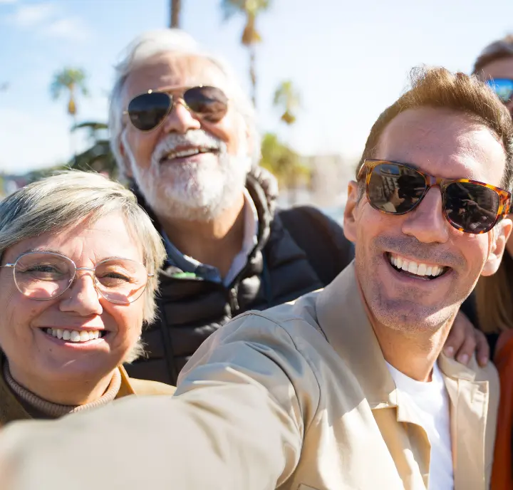 Happy Group Celebrating Parking App Referral Program A happy group outdoors celebrating the parking app referral program that connects them to safe spots.