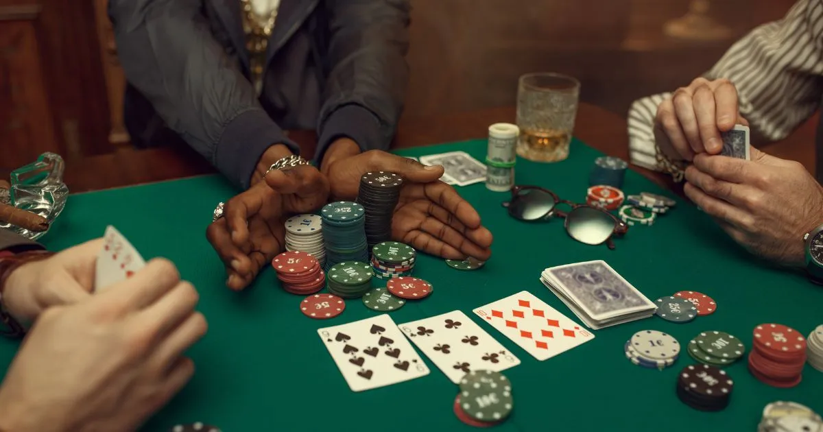 Peoples Hands At Poker Table Gambling