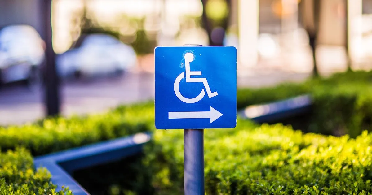 The Accessibility Parking Sign On A Road In Australia