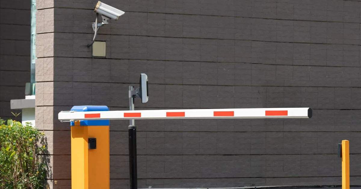 The Automated Entry Gate Of A Parking Lot With Cctv Camera For Security The Automated Entry Gate Of A Parking Lot With Cctv Camera For Security