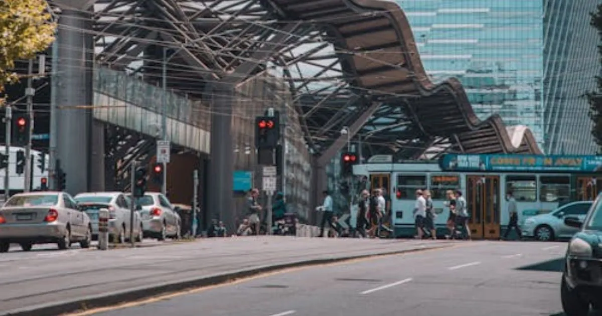 The Melbourne Victoria Road With Pedestrians And Vehicles