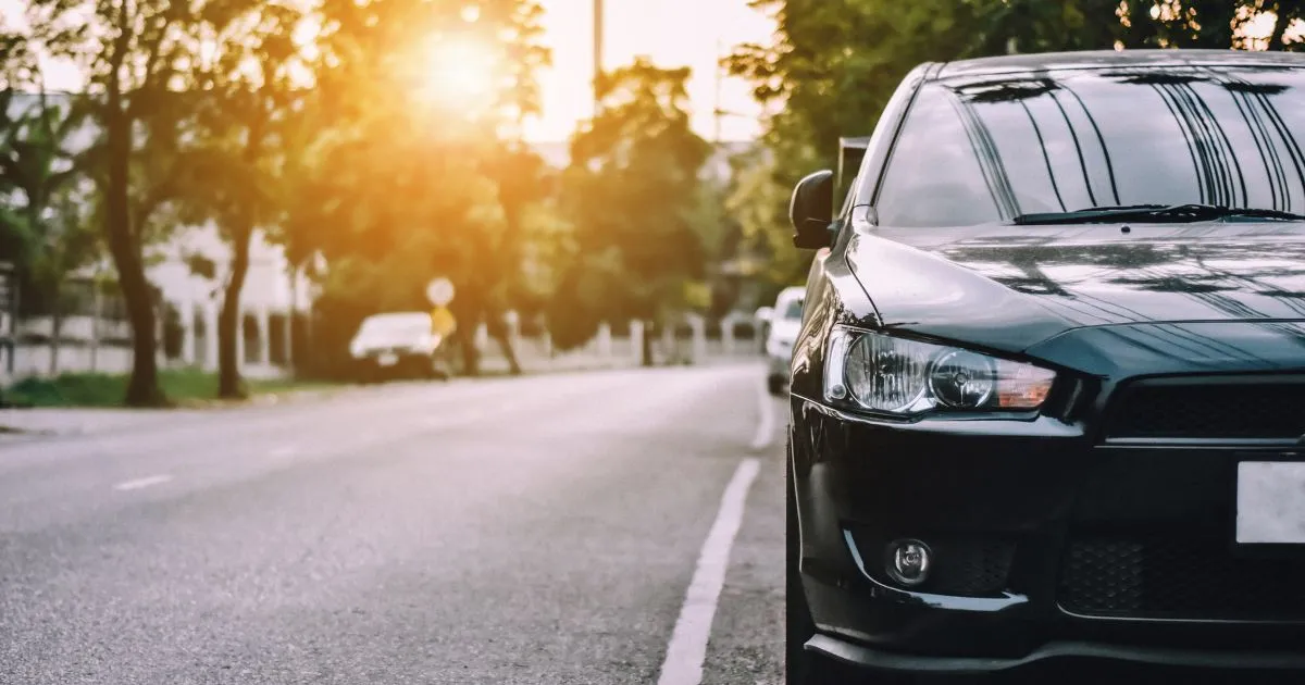 The Morning View Of A Street Parking Space With Some Parked Vehicles