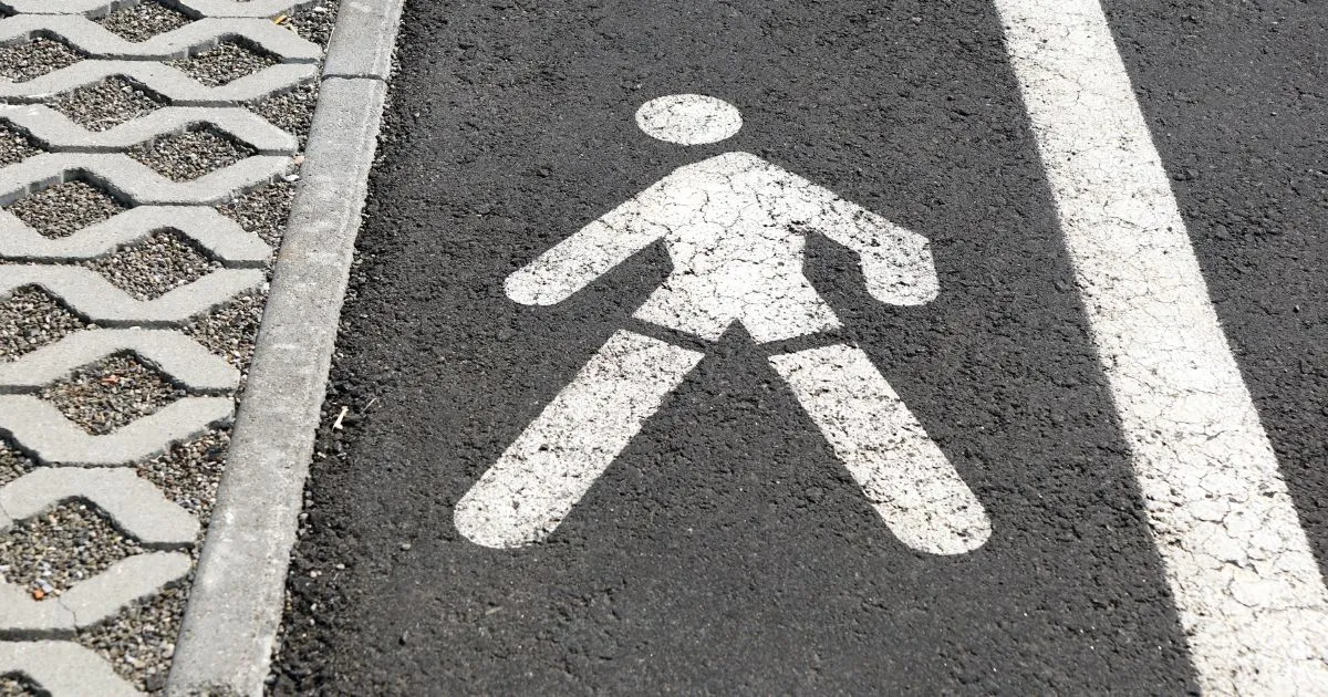 The Pedestrians Walkway Sign In A Parking Lot The Pedestrians Walkway Sign In A Parking Lot