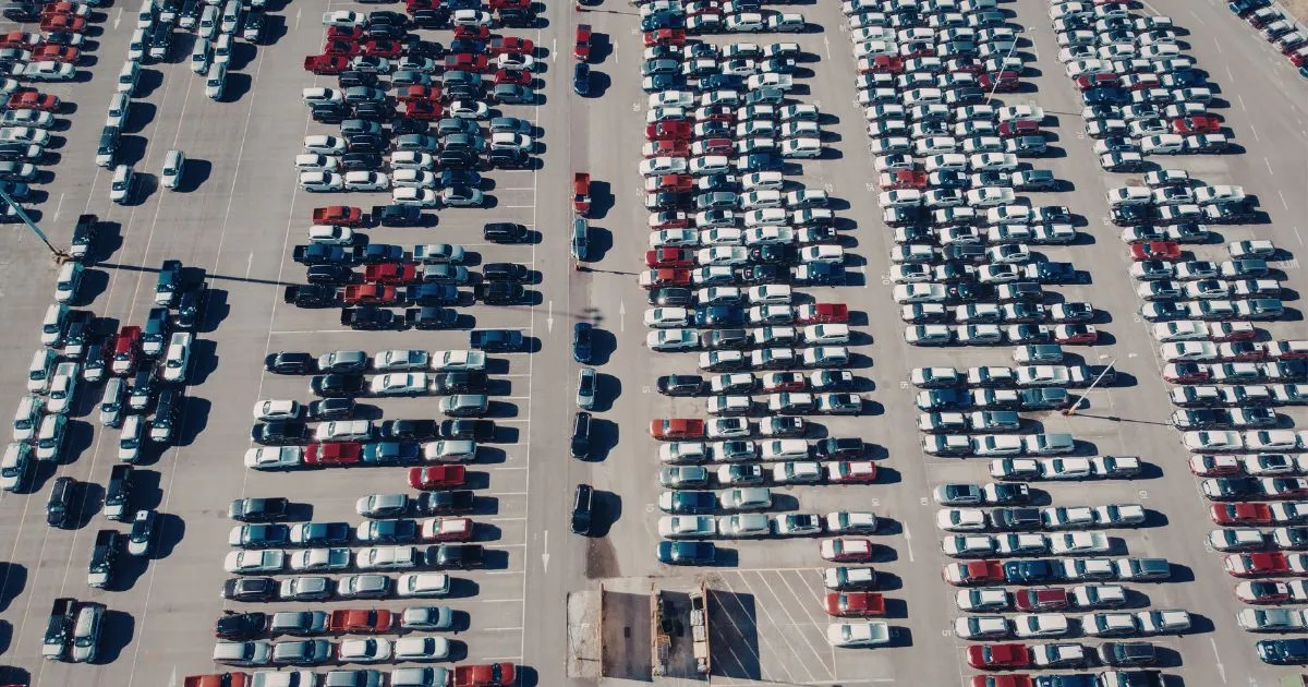 The Top View Of A Well-Managed Car Park Having Both Filled And Empty Parking Spaces The Top View Of A Well-Managed Car Park Having Both Filled And Empty Parking Spaces
