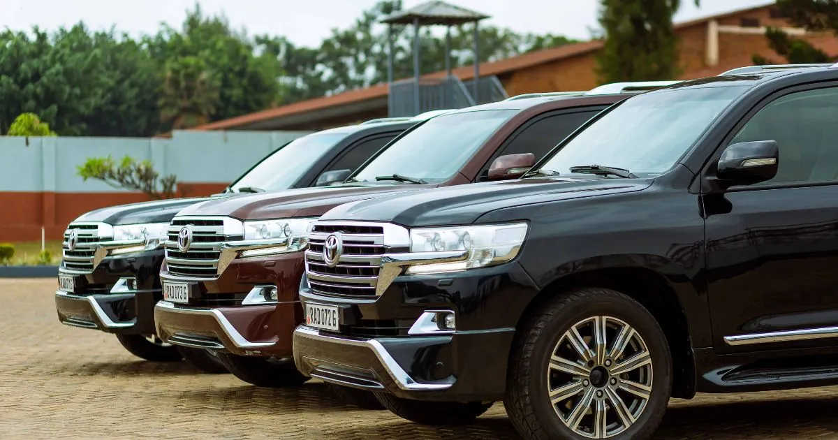 Three Land Cruisers In A Car Park