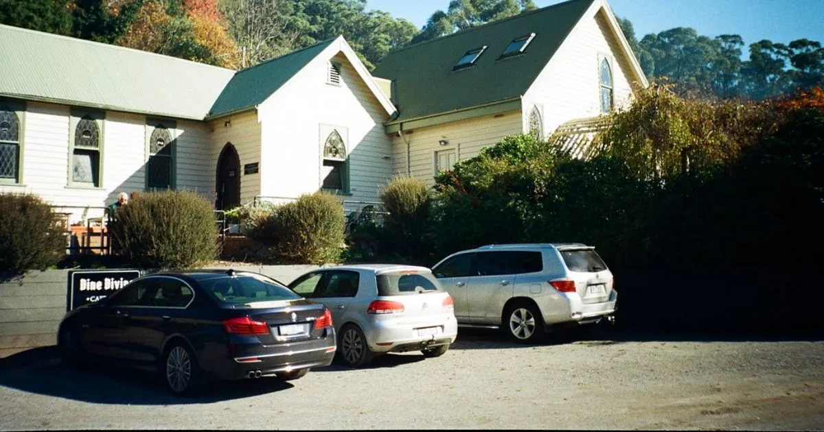 Three Vehicles Parked In An Open Residential Parking Space Three Vehicles Parked In An Open Residential Parking Space