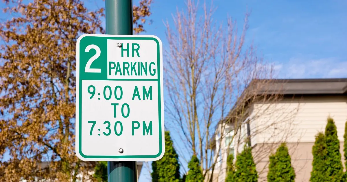 Two Hour Free Parking Sign With Specific Time Range