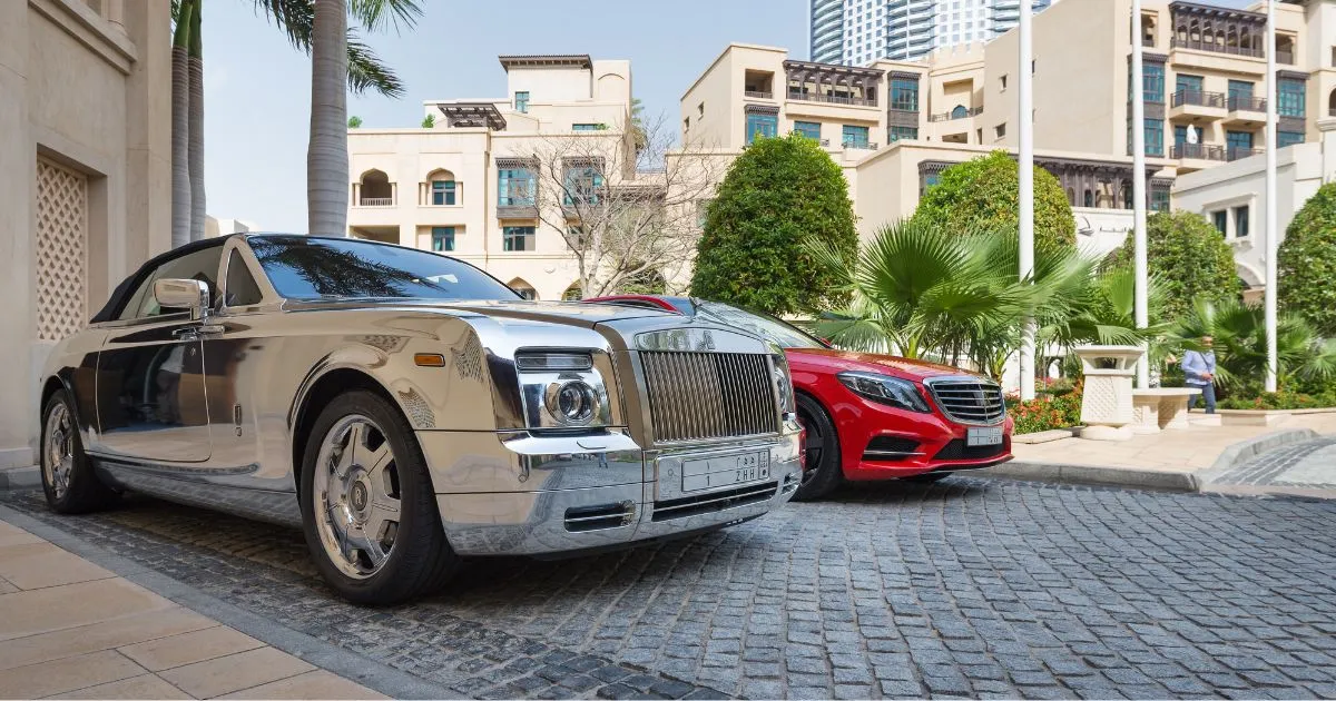 Two Lavish Cars Parked In An Open Residential Parking Space