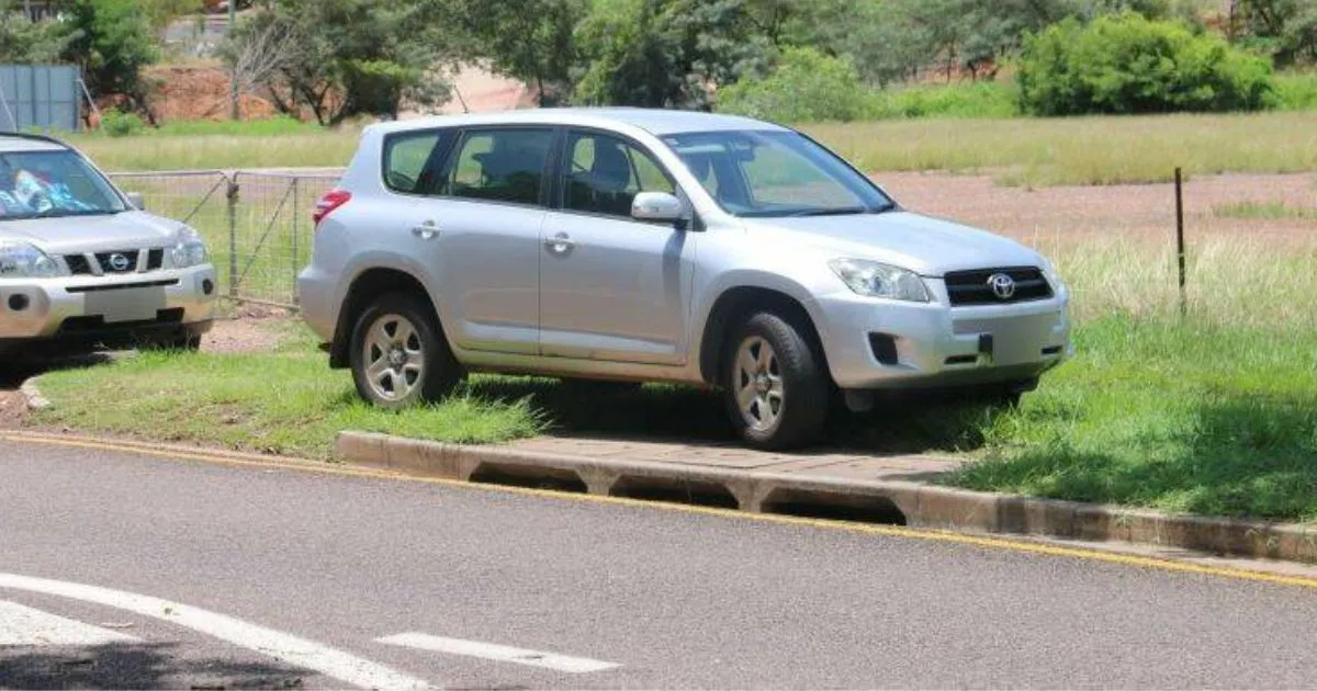 Two Vehicles Illegally Parked On The Footpath