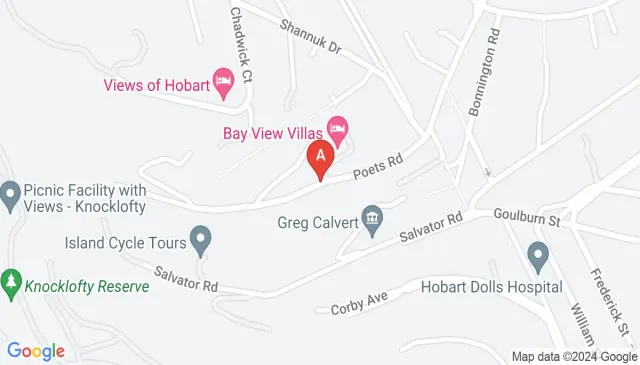 Undercover leafy carport with a view on a quiet street